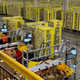 Amazon workers sorting products, randomly, into shelving towers